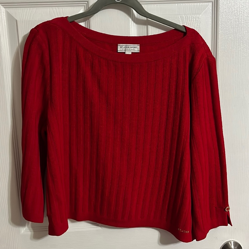 Beautiful light weight sweater with all the details. No flaws. Amazing red.
